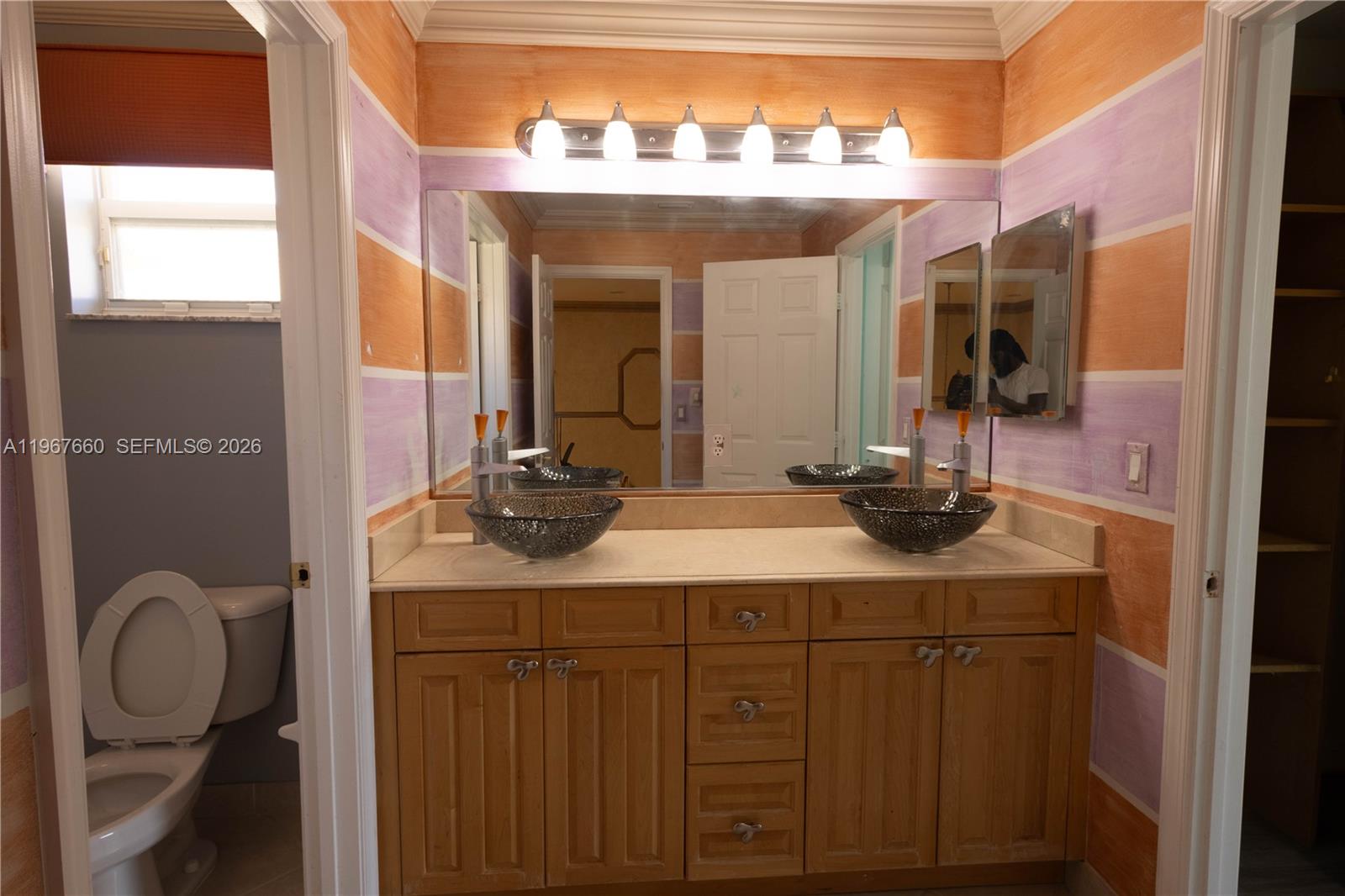 5331 Southwest 159th Avenue, Unit 5331 Miramar, FL 33027 - Photo 20 of 41 a bathroom with a double vanity sink and a mirror