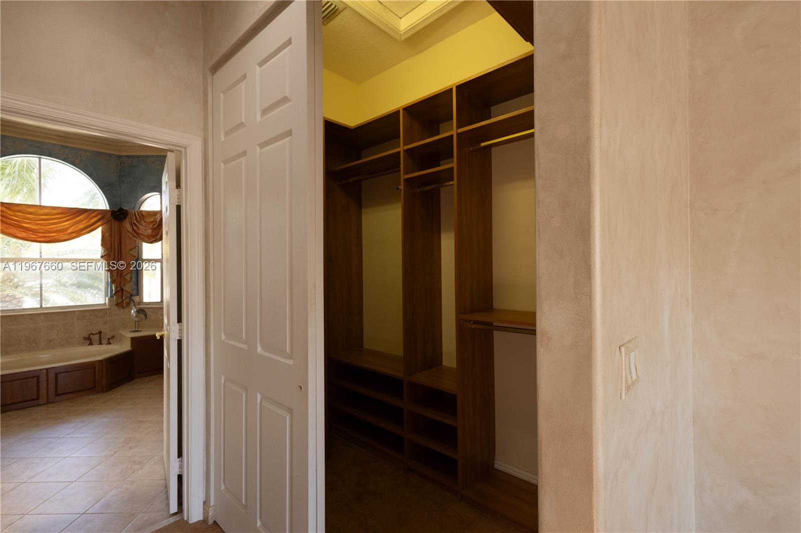 5331 Southwest 159th Avenue, Unit 5331 Miramar, FL 33027 - Photo 29 of 41 a view of walk in closet and bedroom