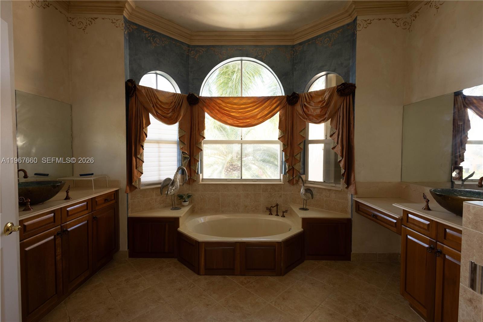 5331 Southwest 159th Avenue, Unit 5331 Miramar, FL 33027 - Photo 30 of 41 a bathroom with a double vanity sink and a mirror