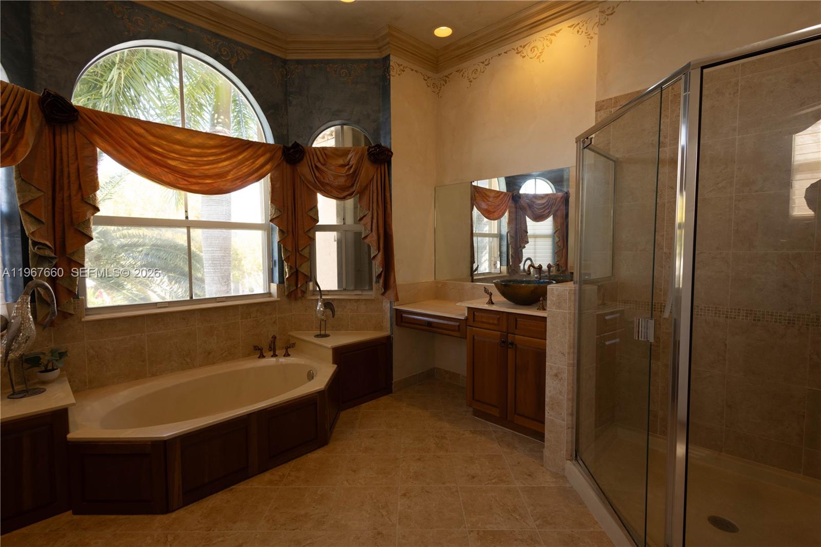 5331 Southwest 159th Avenue, Unit 5331 Miramar, FL 33027 - Photo 31 of 41 a bathroom with a double vanity sink and a bathtub