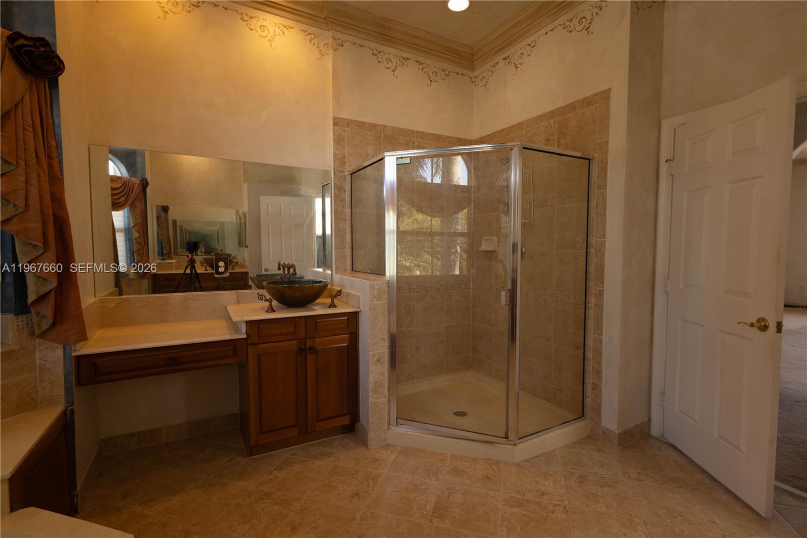 5331 Southwest 159th Avenue, Unit 5331 Miramar, FL 33027 - Photo 33 of 41 a bathroom with a shower a sink and mirror