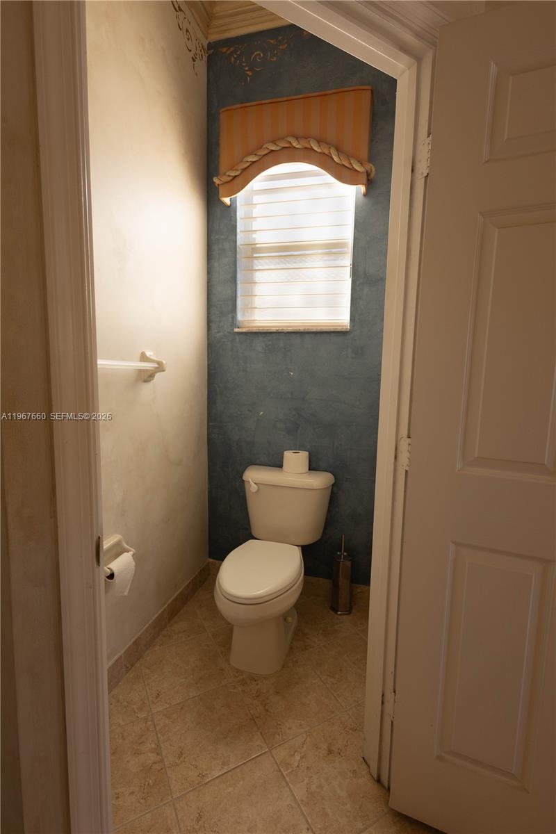 5331 Southwest 159th Avenue, Unit 5331 Miramar, FL 33027 - Photo 36 of 41 a bathroom with a toilet