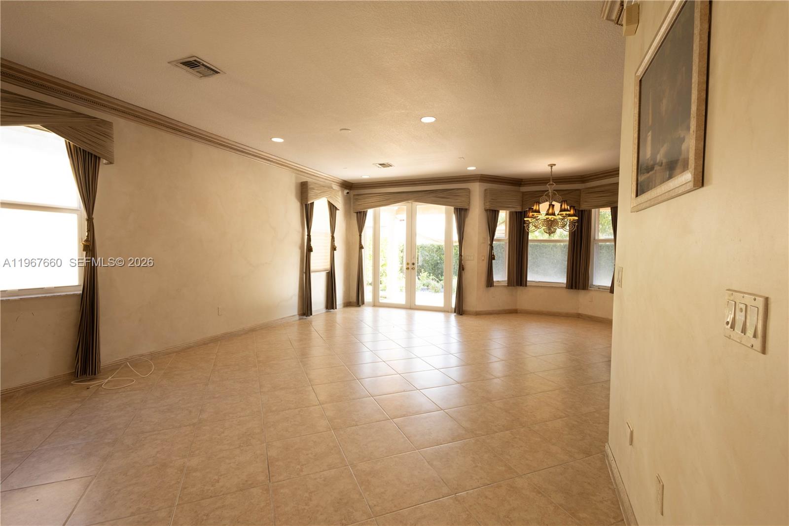 5331 Southwest 159th Avenue, Unit 5331 Miramar, FL 33027 - Photo 8 of 41 a view of an empty room with glass door