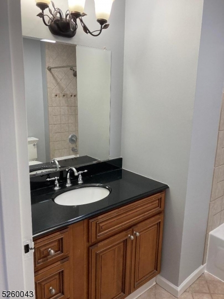 595 Auten Road, Unit 7 Hillsborough, NJ 08844 - Photo 14 of 15 a bathroom with a sink and a mirror