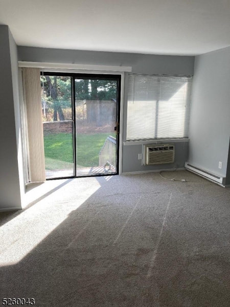 595 Auten Road, Unit 7 Hillsborough, NJ 08844 - Photo 6 of 15 a view of empty room with floor to ceiling window