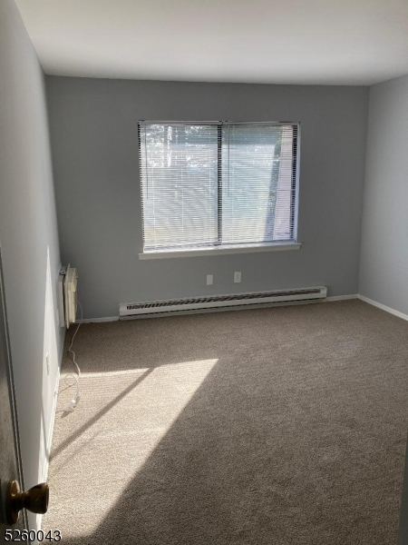 595 Auten Road, Unit 7 Hillsborough, NJ 08844 - Photo 9 of 15 an empty room with windows