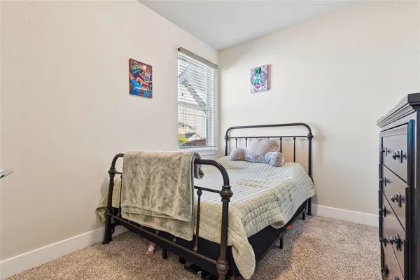 a spacious bathroom with a double vanity sink toilet mirror and shower