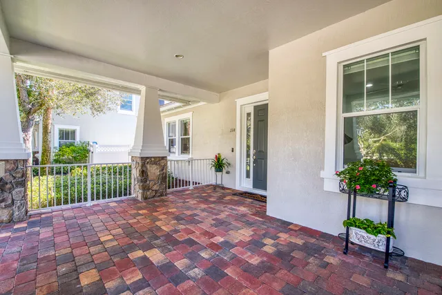 a porch with a table and chairs in patio