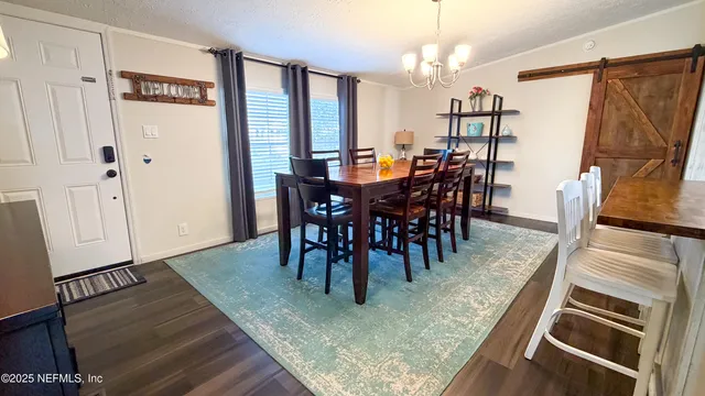 a view of a dining room with furniture