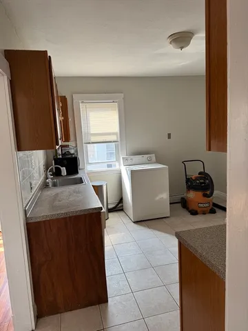 a kitchen with a sink and a stove
