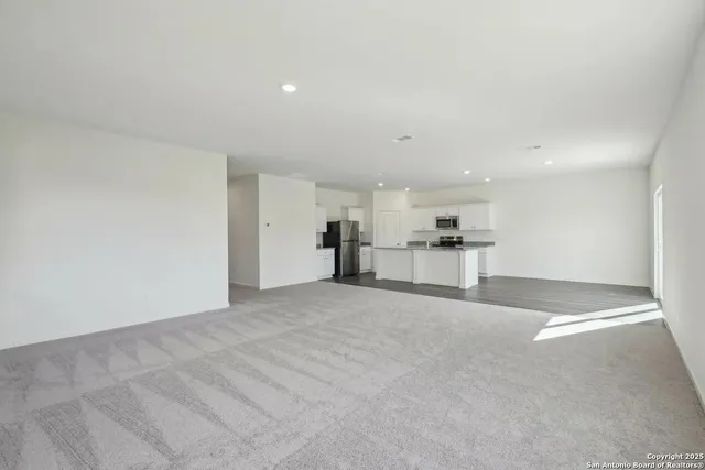 a view of a kitchen with a sink and cabinets