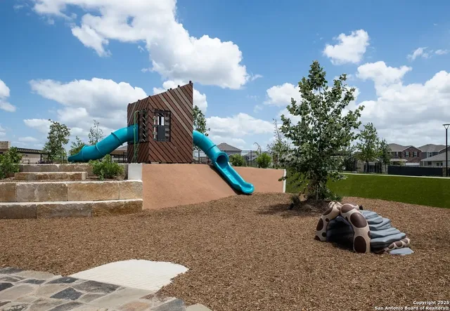 a view of a backyard of the house