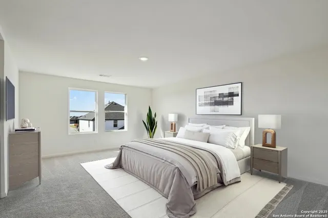 a bedroom with a large bed and a couch