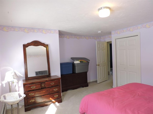 188 Ramshorn Road Dudley, MA 01571 - Photo 20 of 30 a bedroom with a bed and dresser with mirror