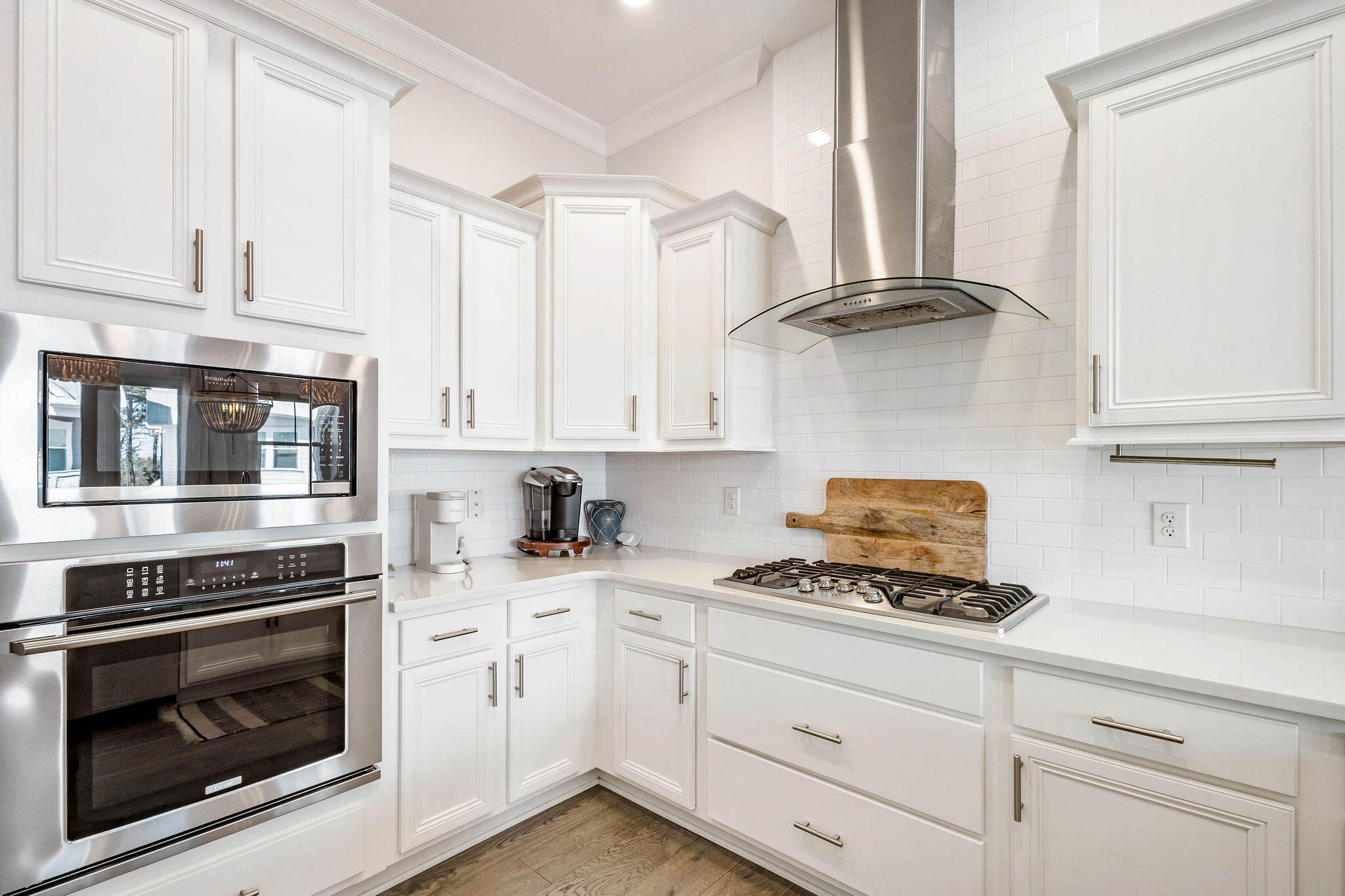 296 Milestone Dr Inlet Beach, Unit C Inlet Beach, FL 32461 - Photo 11 of 51 a kitchen with stainless steel appliances white cabinets and a stove a refrigerator