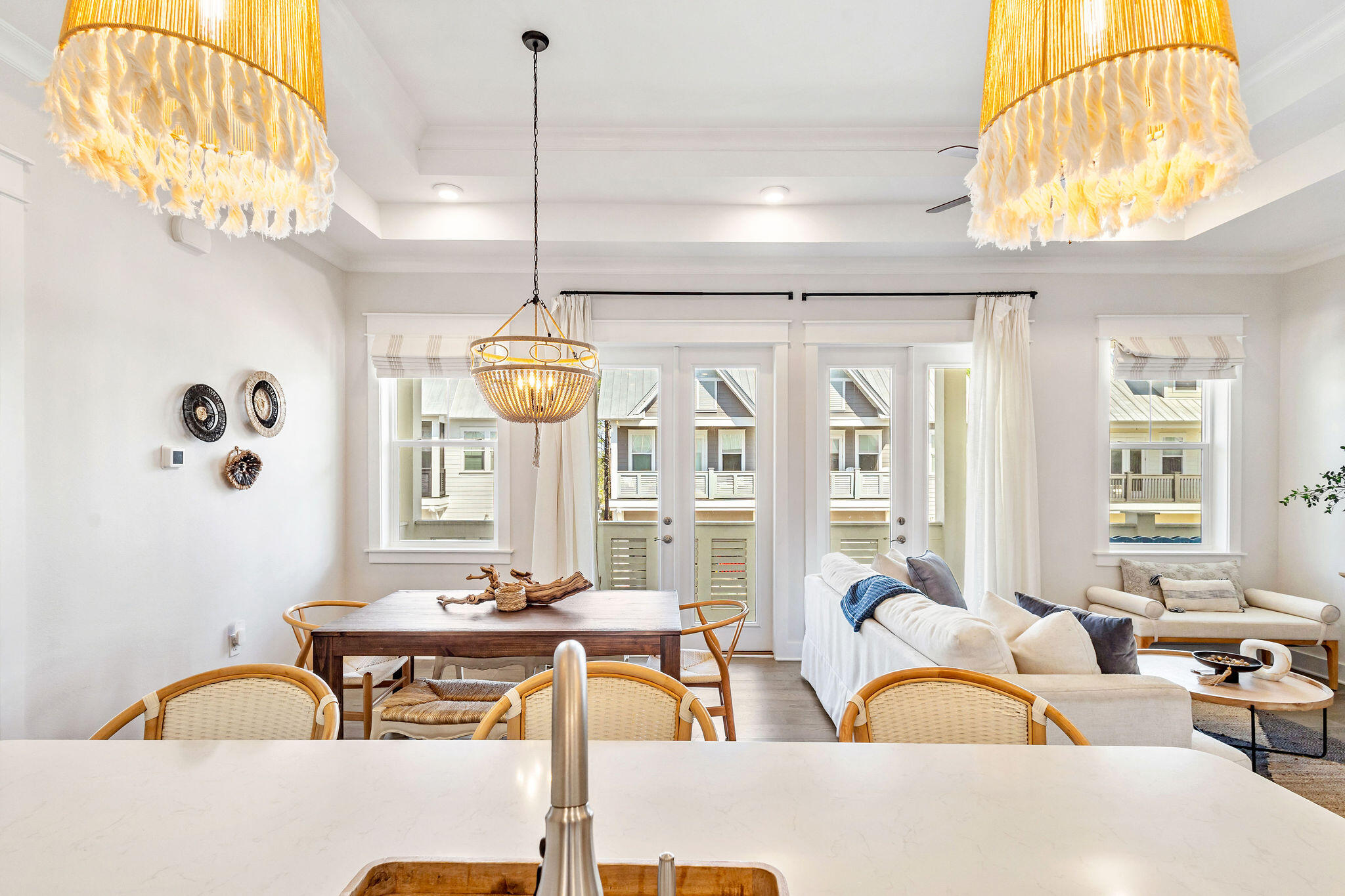 296 Milestone Dr Inlet Beach, Unit C Inlet Beach, FL 32461 - Photo 12 of 51 a living room with patio furniture and a chandelier