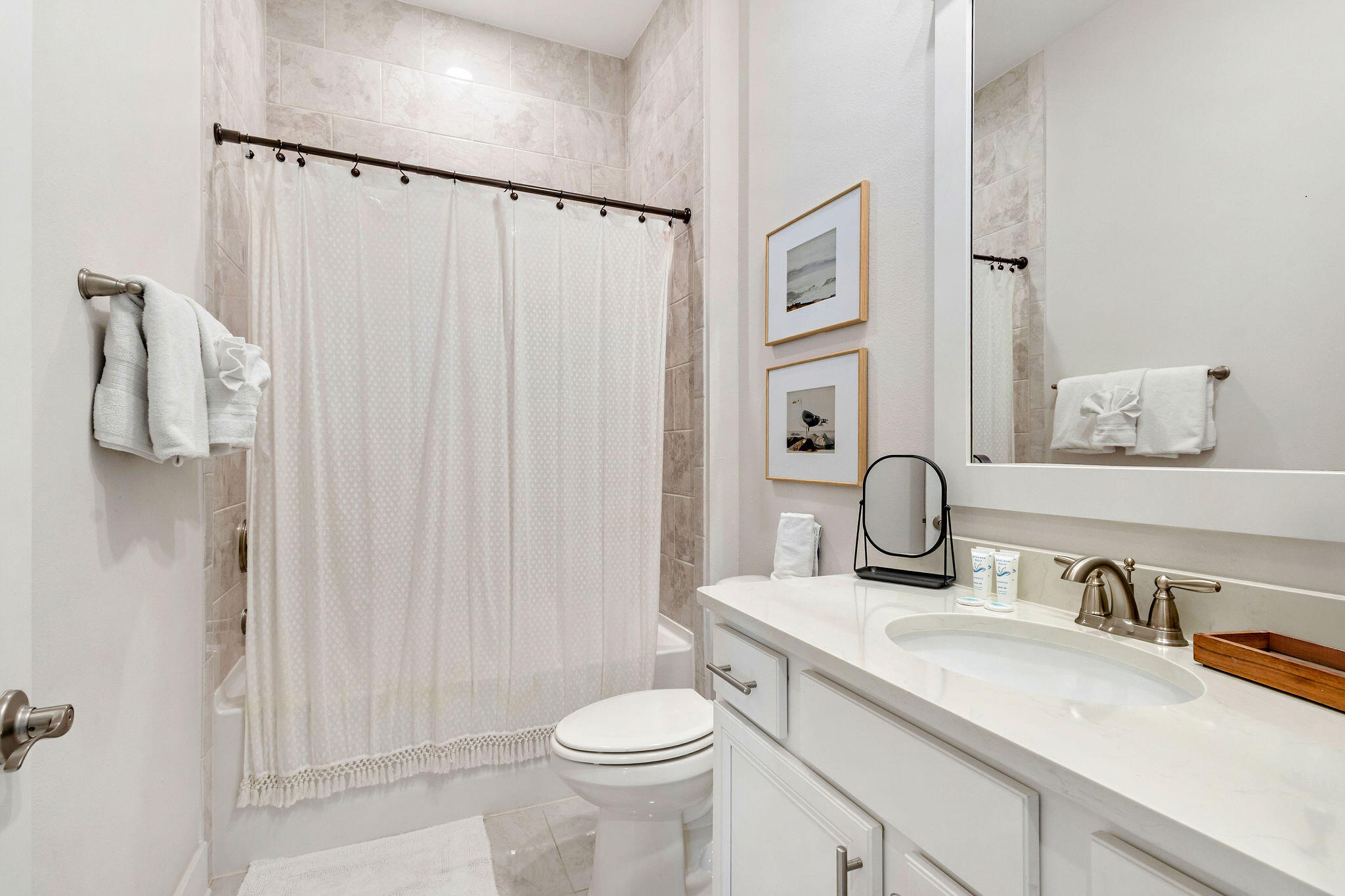 296 Milestone Dr Inlet Beach, Unit C Inlet Beach, FL 32461 - Photo 16 of 51 a bathroom with a sink a toilet and shower curtain