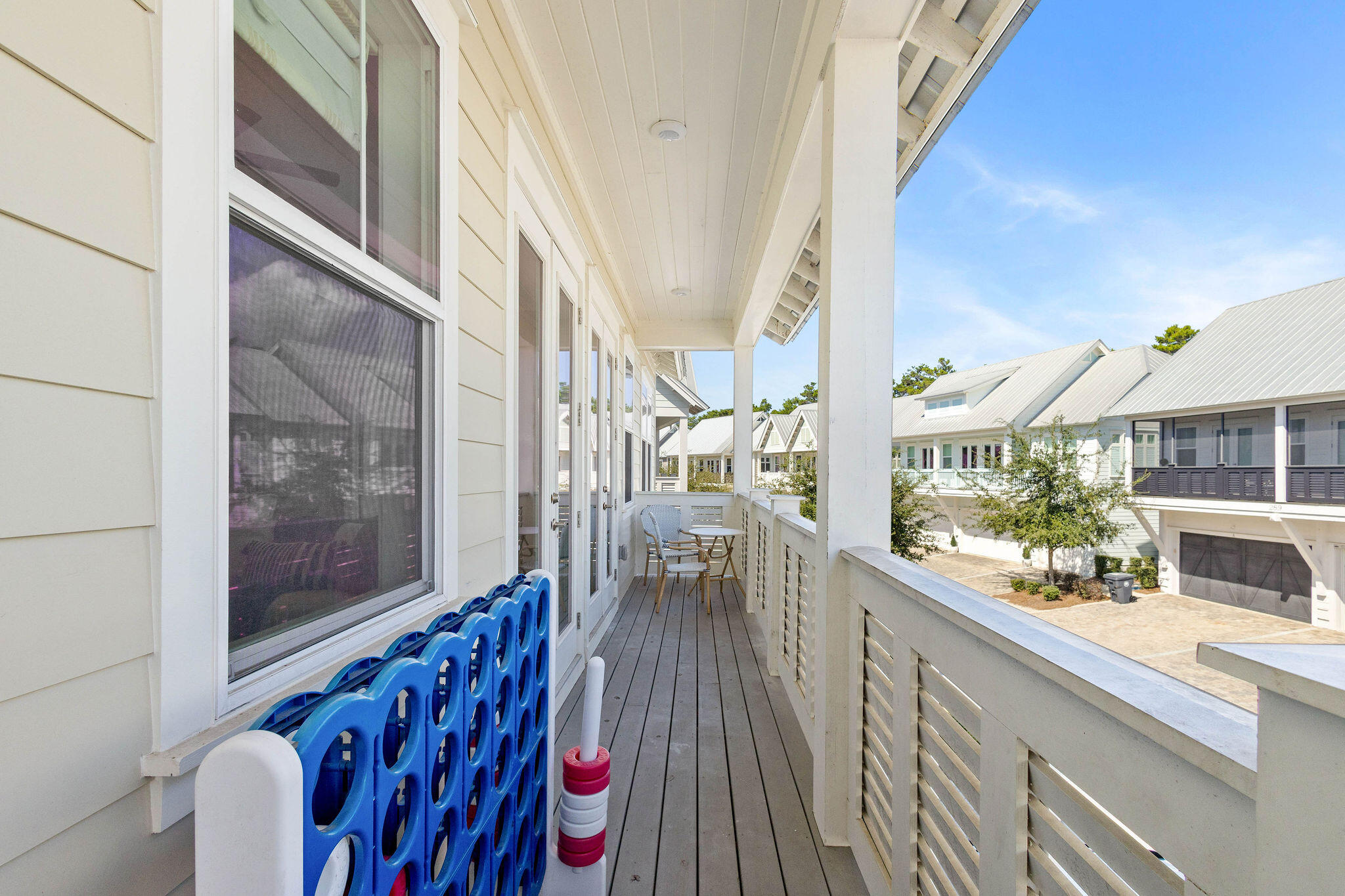 296 Milestone Dr Inlet Beach, Unit C Inlet Beach, FL 32461 - Photo 20 of 51 a view of balcony and wooden floor