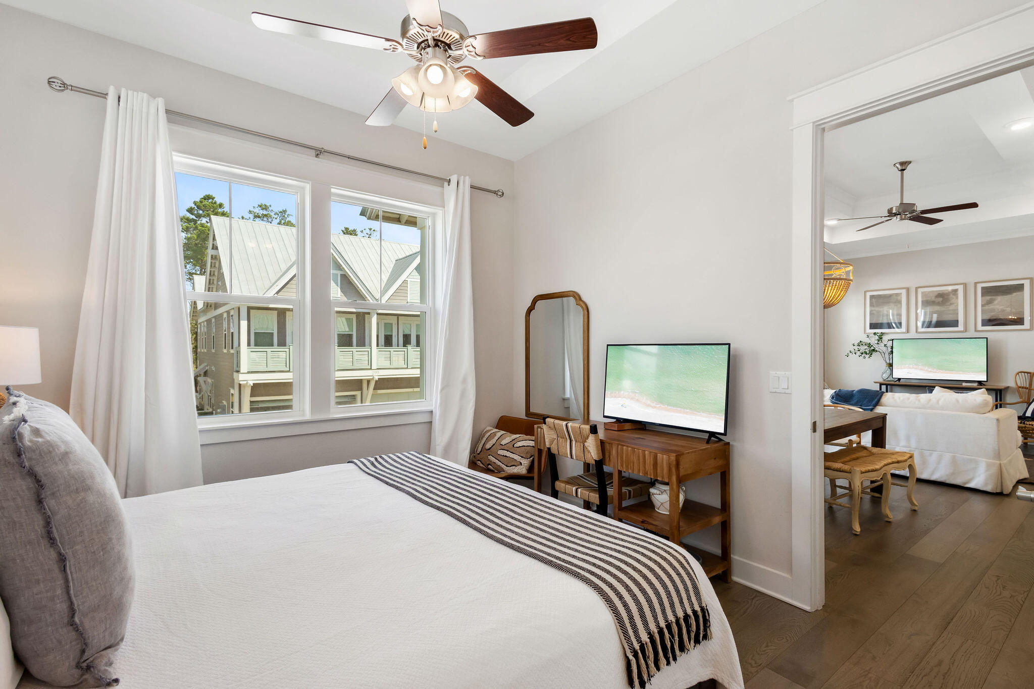 296 Milestone Dr Inlet Beach, Unit C Inlet Beach, FL 32461 - Photo 24 of 51 a bedroom with a bed and wooden floor