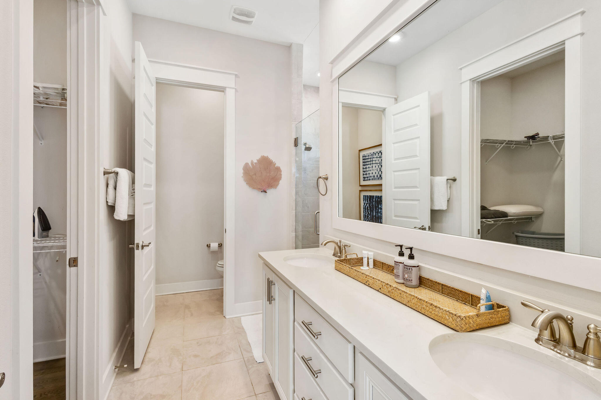 296 Milestone Dr Inlet Beach, Unit C Inlet Beach, FL 32461 - Photo 25 of 51 a spacious bathroom with a double vanity sink mirror and double