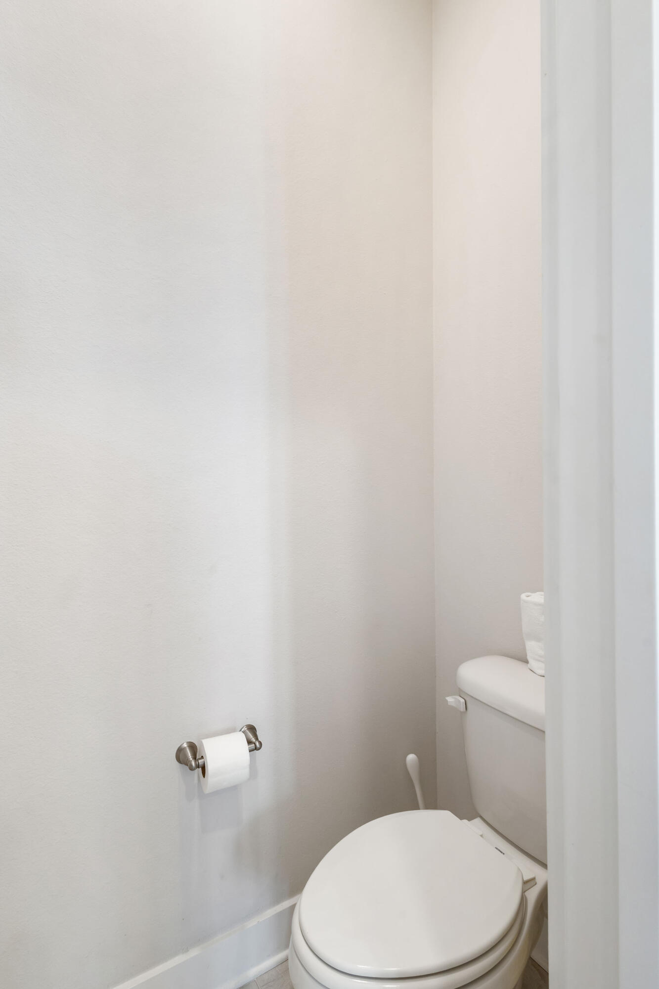 296 Milestone Dr Inlet Beach, Unit C Inlet Beach, FL 32461 - Photo 29 of 51 a white toilet sitting next to a white wall