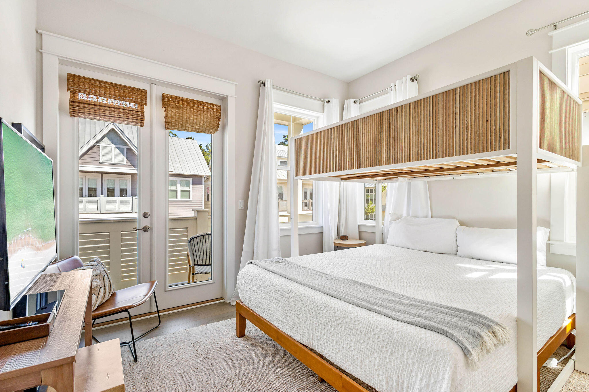 296 Milestone Dr Inlet Beach, Unit C Inlet Beach, FL 32461 - Photo 4 of 51 a bedroom with a bed and a dresser next to a window