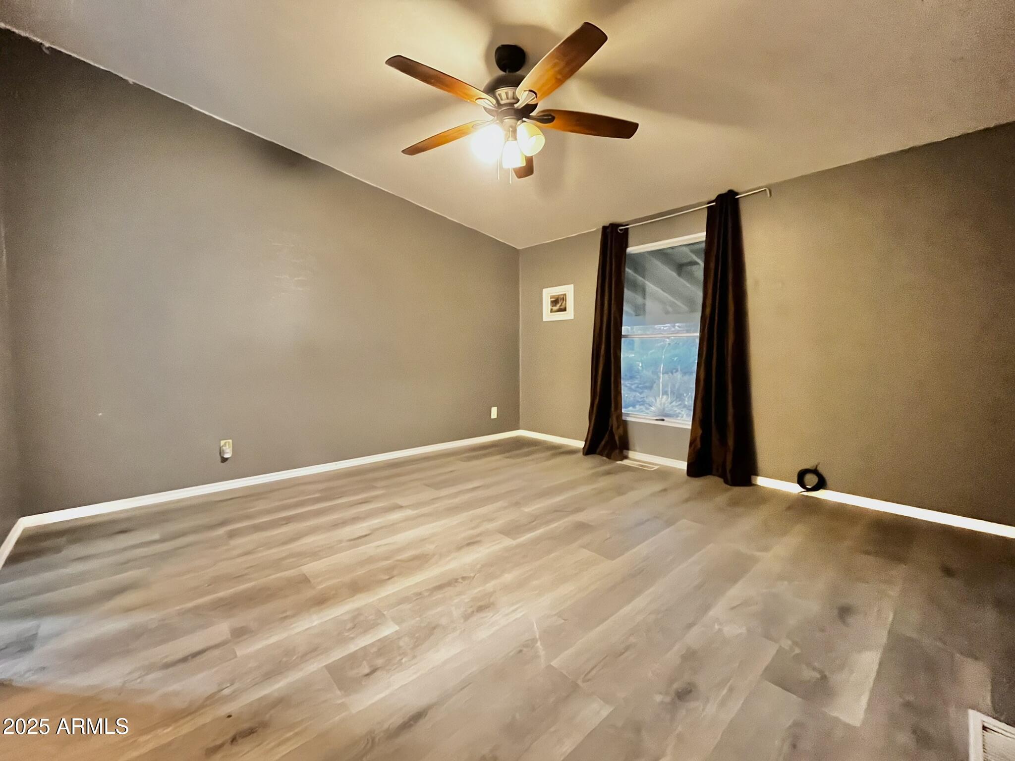 5943 North Bordeaux Road Rimrock, AZ 86335 - Photo 12 of 38 a view of an empty room with a ceiling fan