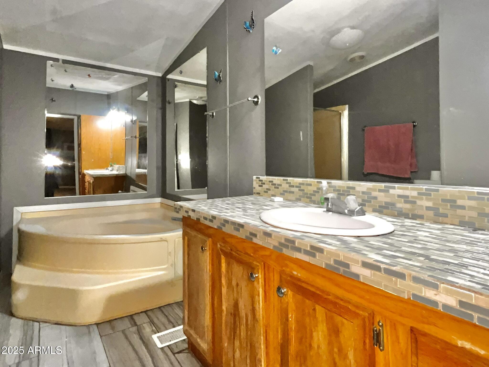 5943 North Bordeaux Road Rimrock, AZ 86335 - Photo 14 of 38 a bathroom with a granite countertop sink and a mirror