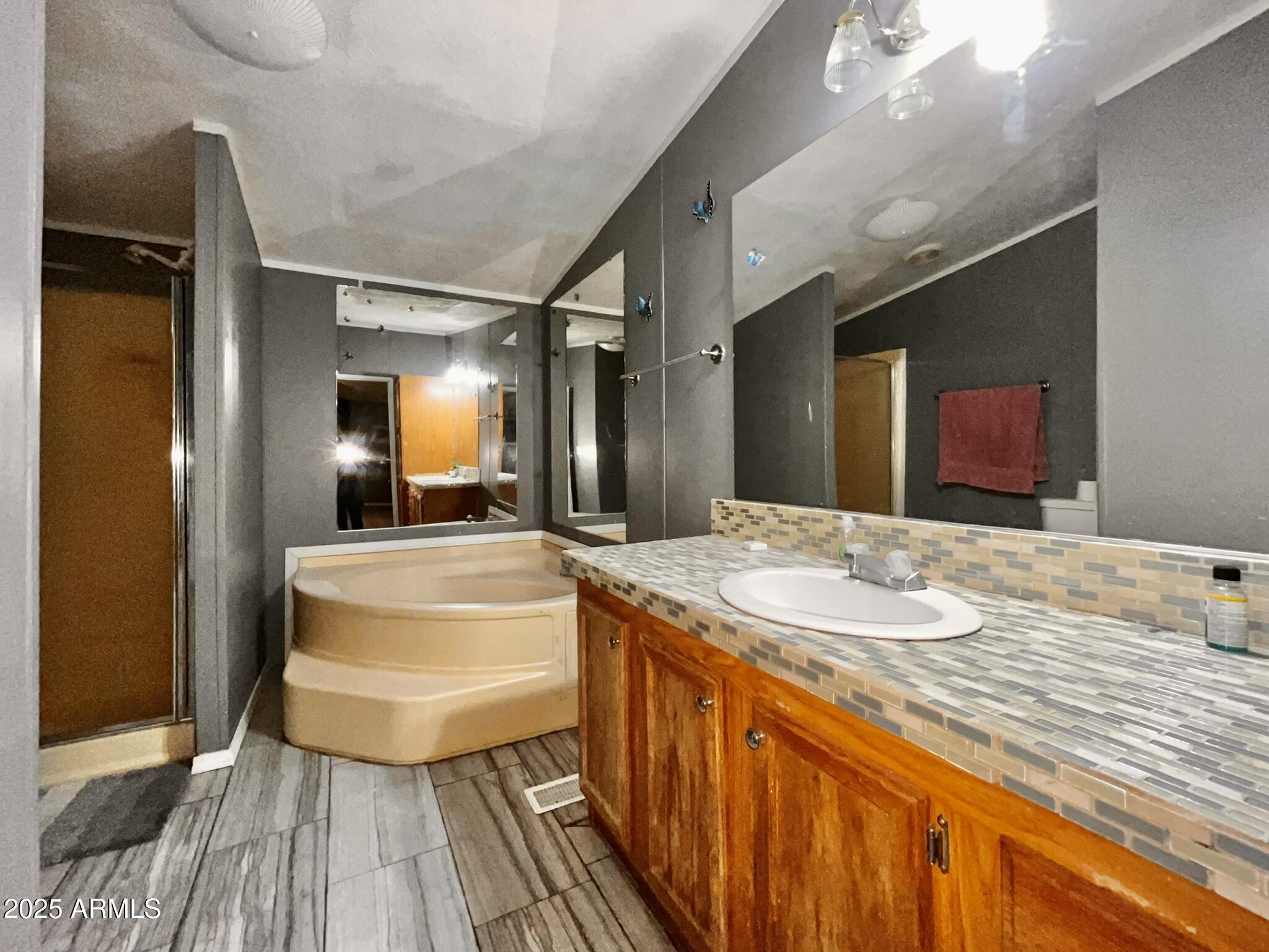 5943 North Bordeaux Road Rimrock, AZ 86335 - Photo 16 of 38 a spacious bathroom with a granite countertop sink and a mirror
