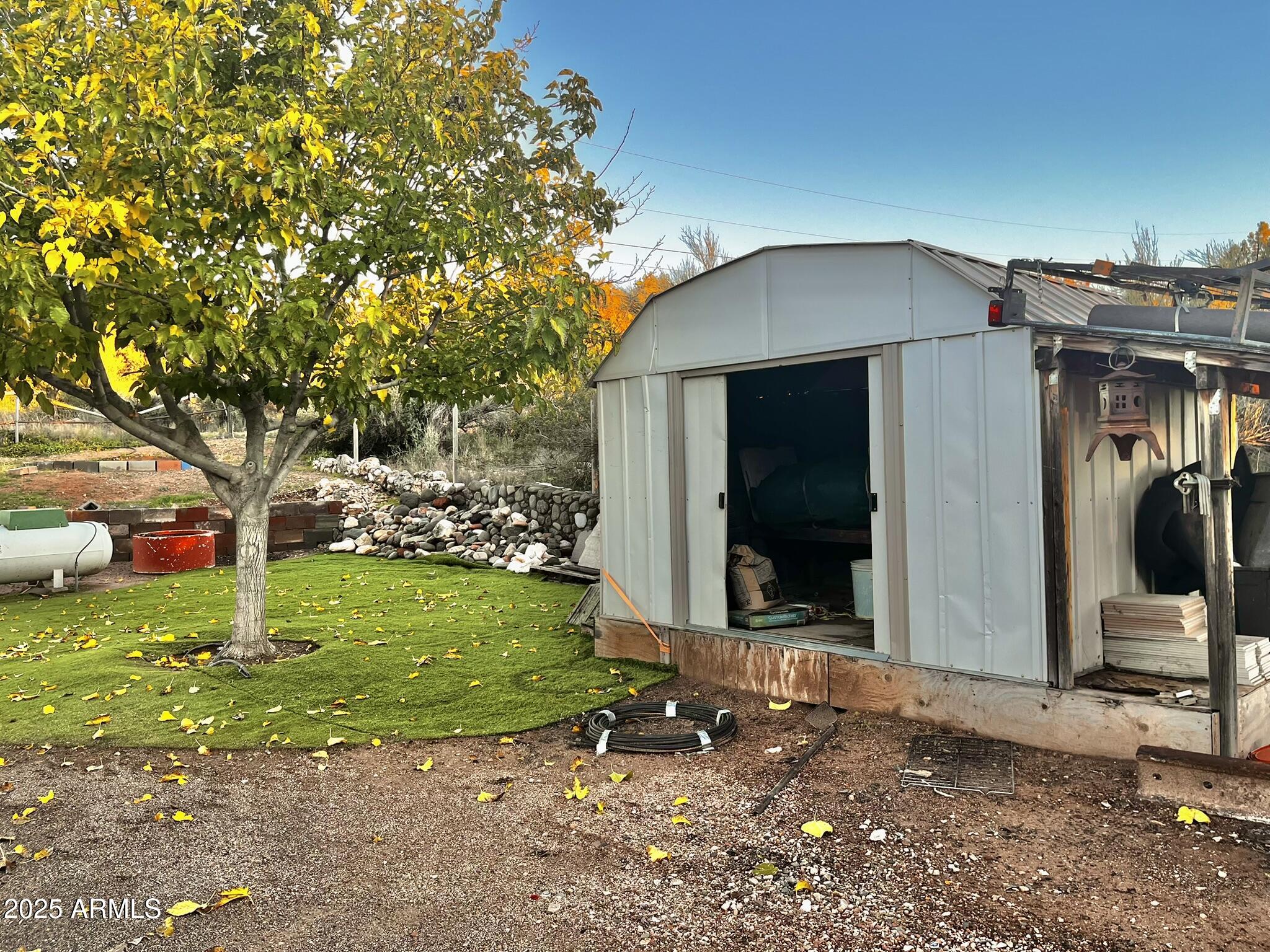 5943 North Bordeaux Road Rimrock, AZ 86335 - Photo 26 of 38 a front view of a house with garden