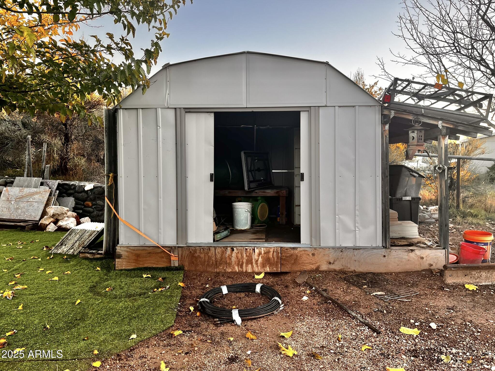5943 North Bordeaux Road Rimrock, AZ 86335 - Photo 27 of 38 a front view of a house with garden