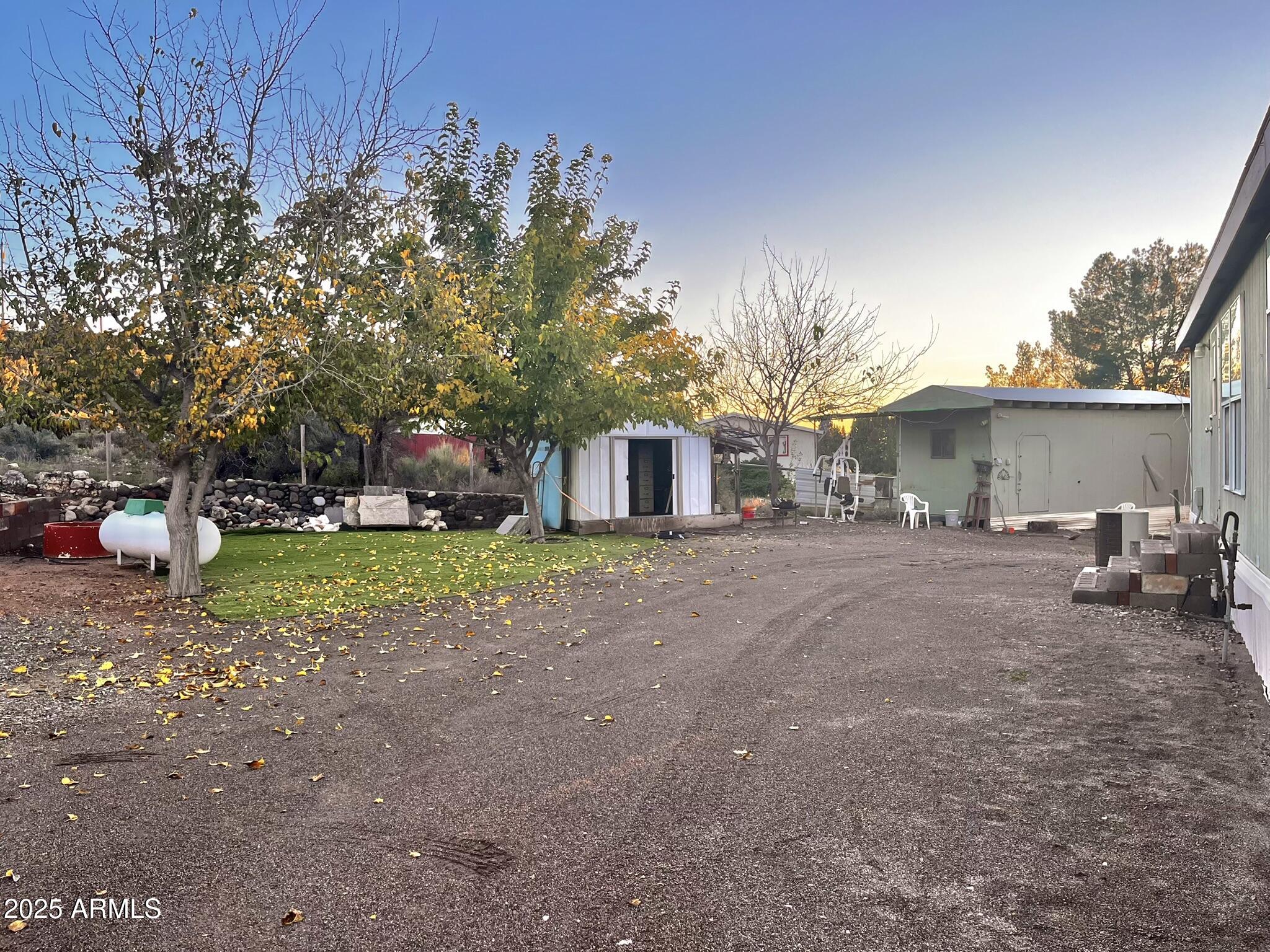 5943 North Bordeaux Road Rimrock, AZ 86335 - Photo 30 of 38 a front view of a house with a yard and garage