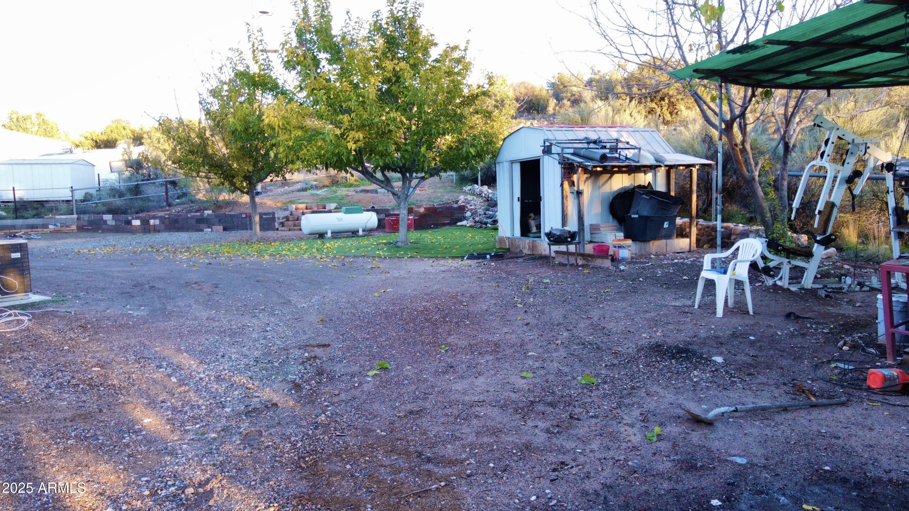 5943 North Bordeaux Road Rimrock, AZ 86335 - Photo 31 of 38 a view of a house with a yard and sitting area