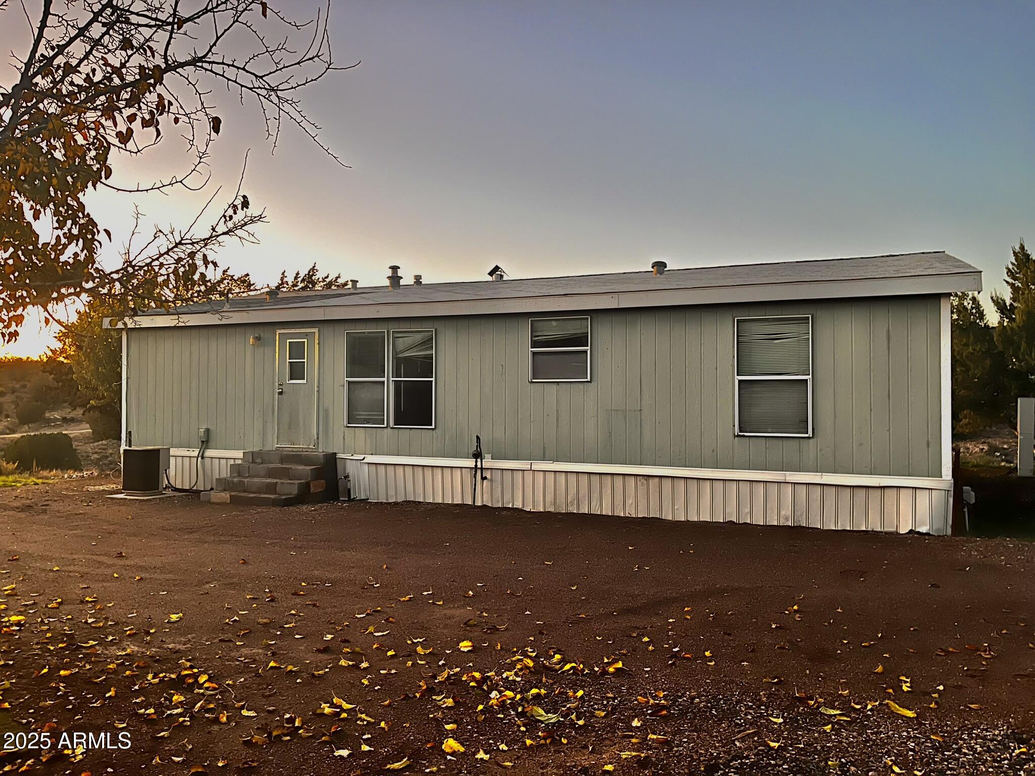 5943 North Bordeaux Road Rimrock, AZ 86335 - Photo 35 of 38 a view of a house with a backyard
