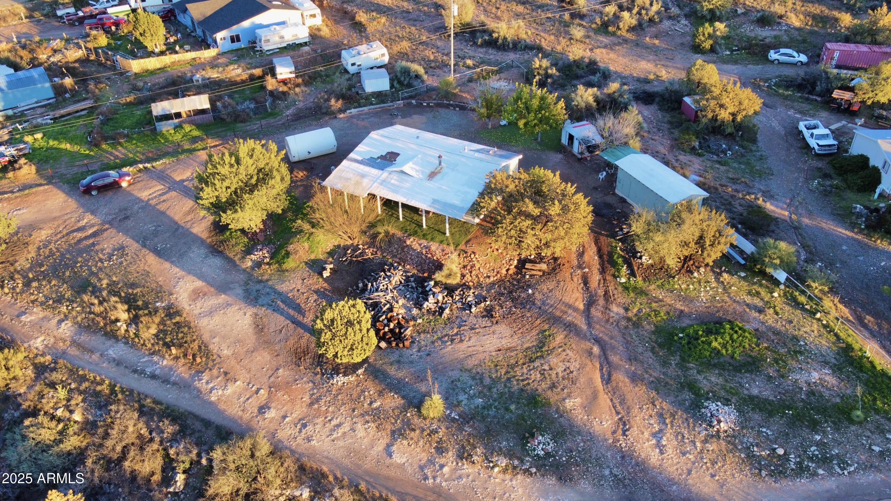 5943 North Bordeaux Road Rimrock, AZ 86335 - Photo 37 of 38 an aerial view of a house a yard and mountain view in back