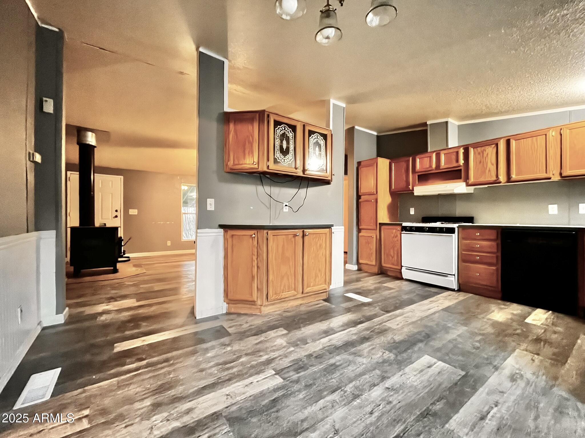 5943 North Bordeaux Road Rimrock, AZ 86335 - Photo 5 of 38 a view of kitchen with stainless steel appliances granite countertop a stove top oven a sink and dishwasher