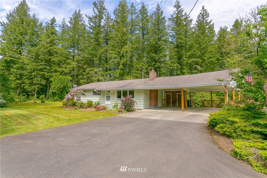 8980 Kendall Road Sumas, WA 98295 - Photo 2 of 39 a view of a house next to a big yard and large trees