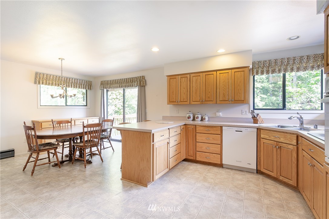 8980 Kendall Road Sumas, WA 98295 - Photo 7 of 39 a kitchen with sink a window and dining table