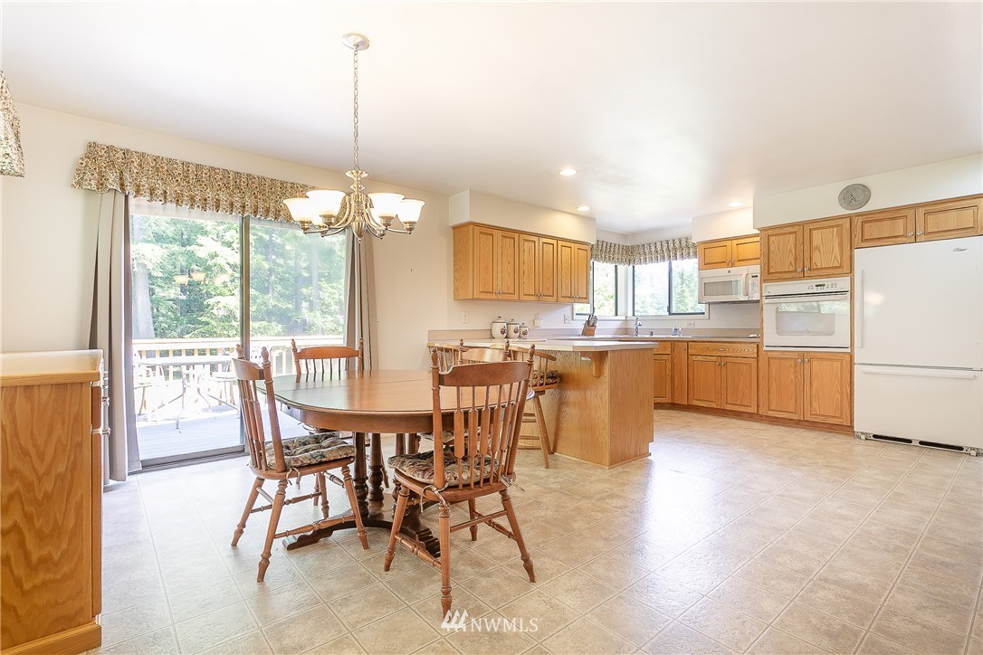 8980 Kendall Road Sumas, WA 98295 - Photo 10 of 39 a view of a dining room with furniture and chandelier