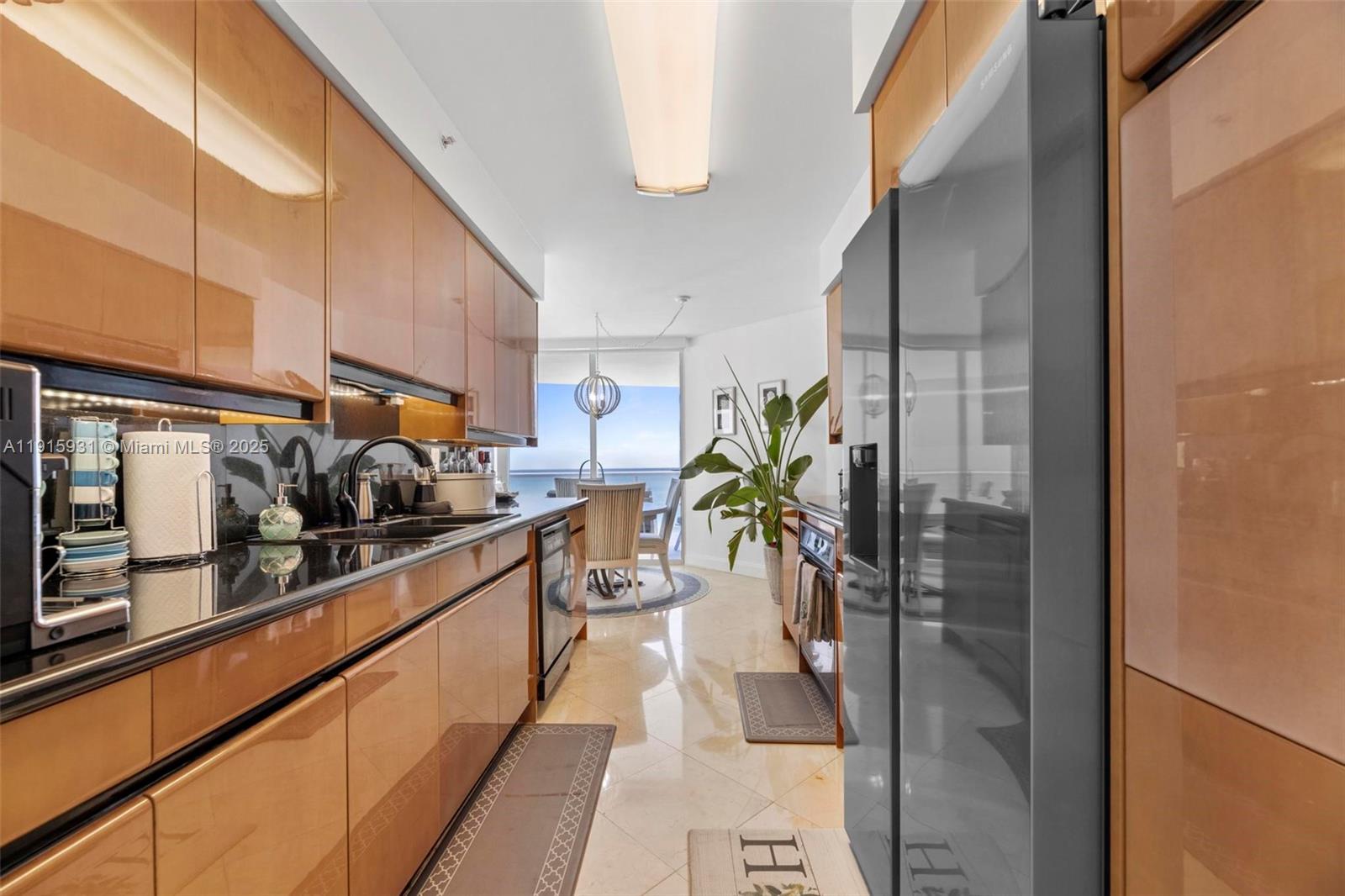 18671 Collins Avenue, Unit 1902 Sunny Isles Beach, FL 33160 - Photo 11 of 53 a kitchen with granite countertop lots of counter top space