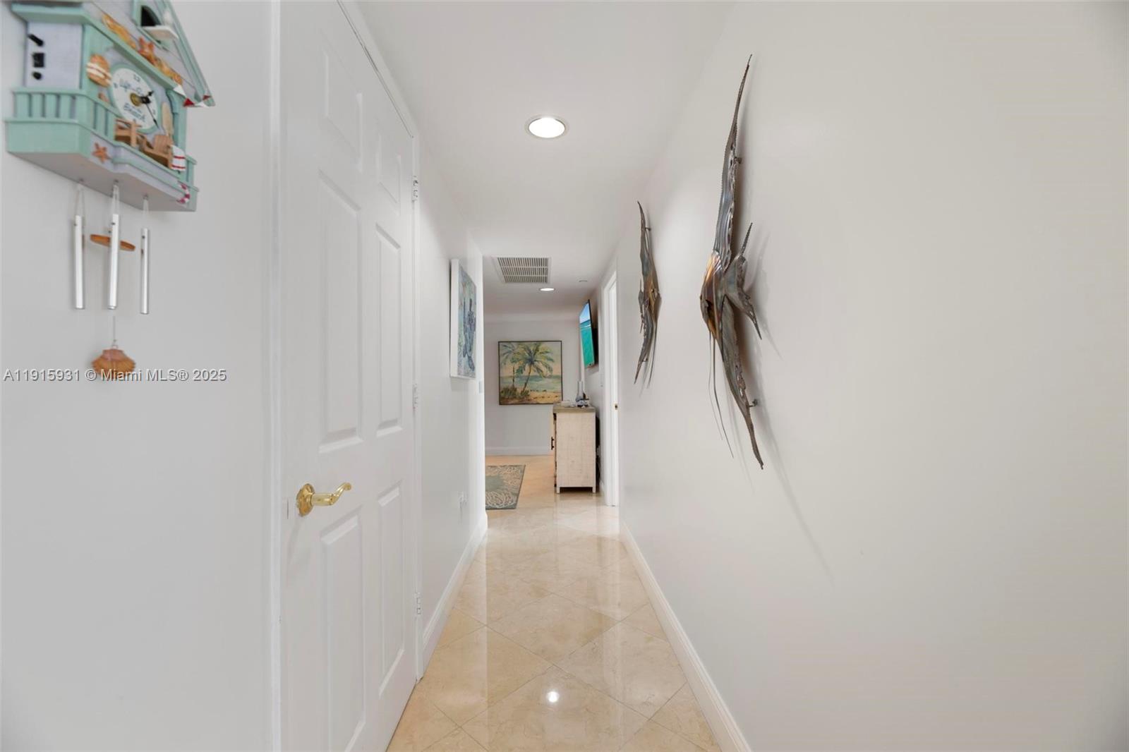 18671 Collins Avenue, Unit 1902 Sunny Isles Beach, FL 33160 - Photo 13 of 53 a view of a hallway with staircase
