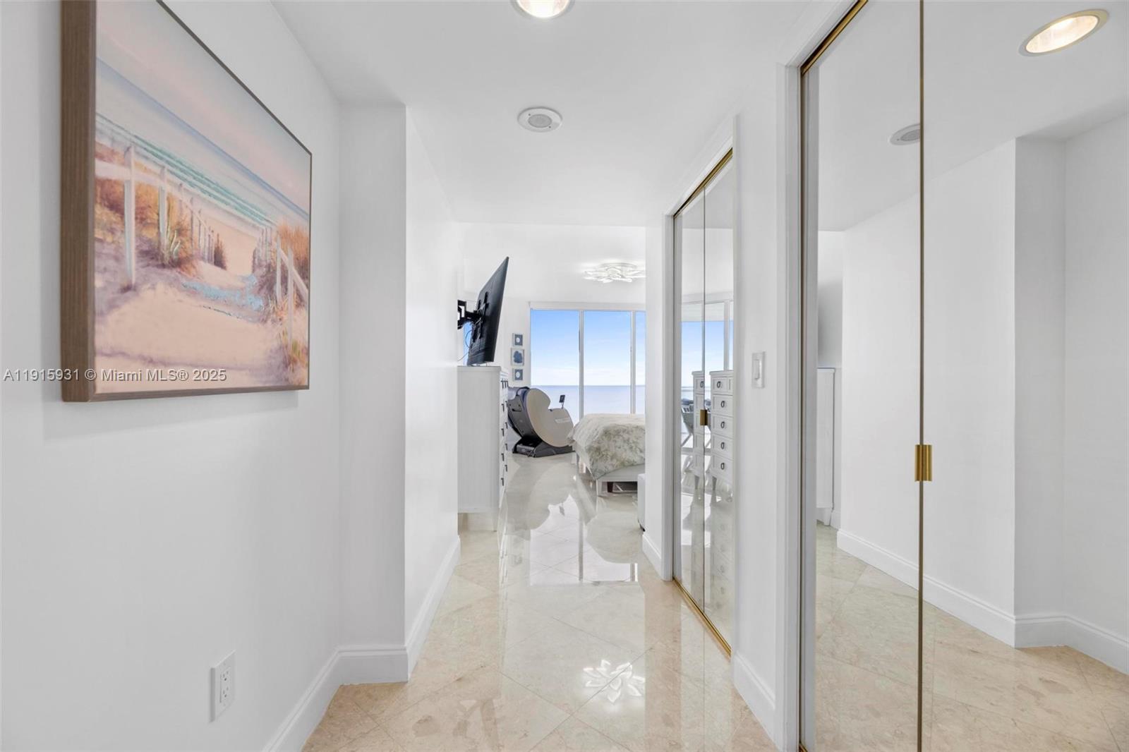18671 Collins Avenue, Unit 1902 Sunny Isles Beach, FL 33160 - Photo 18 of 53 a view of a hallway with a living room