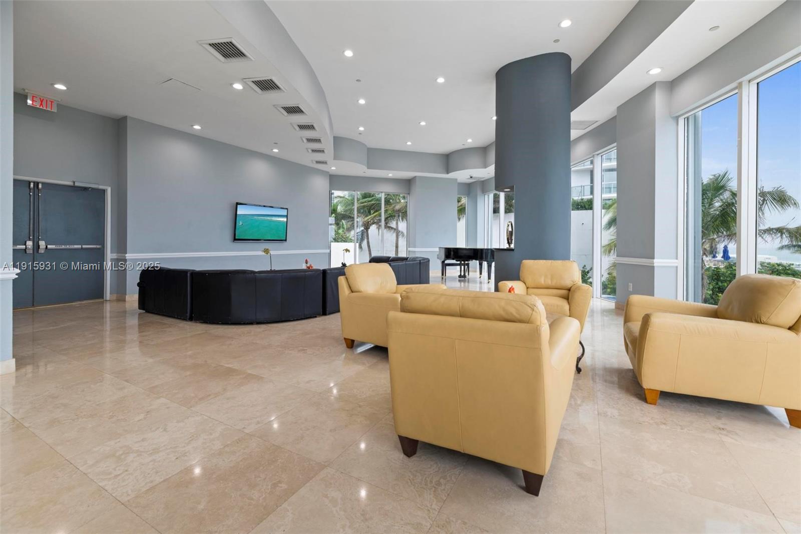 18671 Collins Avenue, Unit 1902 Sunny Isles Beach, FL 33160 - Photo 40 of 53 a living room with furniture a large window and kitchen view