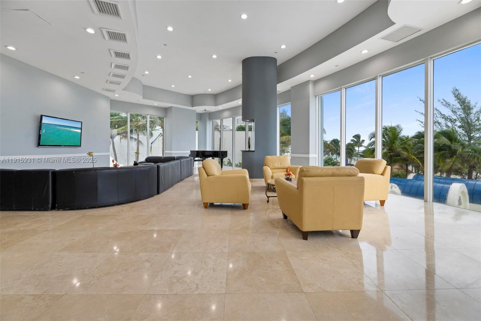 18671 Collins Avenue, Unit 1902 Sunny Isles Beach, FL 33160 - Photo 41 of 53 a living room with furniture and a large window