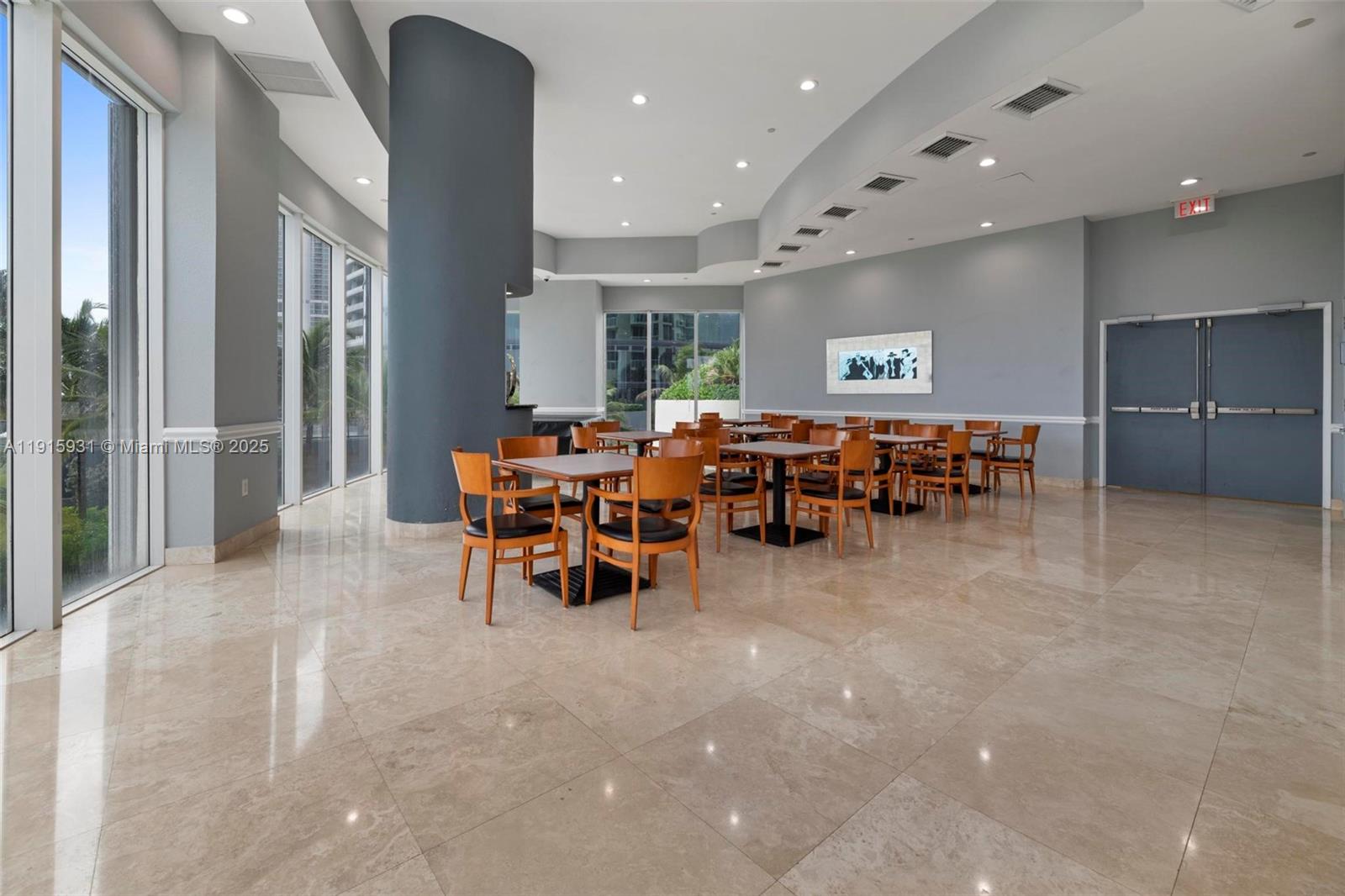 18671 Collins Avenue, Unit 1902 Sunny Isles Beach, FL 33160 - Photo 43 of 53 a view of a big room with furniture window and outside view