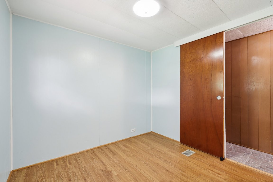 201 Bronco Drive Burnet, TX 78611 - Photo 16 of 30 a view of an empty room with wooden floor