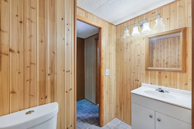 a bathroom with a sink a mirror and a shower