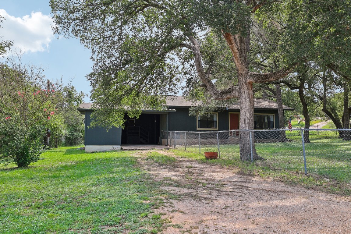 201 Bronco Drive Burnet, TX 78611 - Photo 2 of 30 a view of a house with a backyard