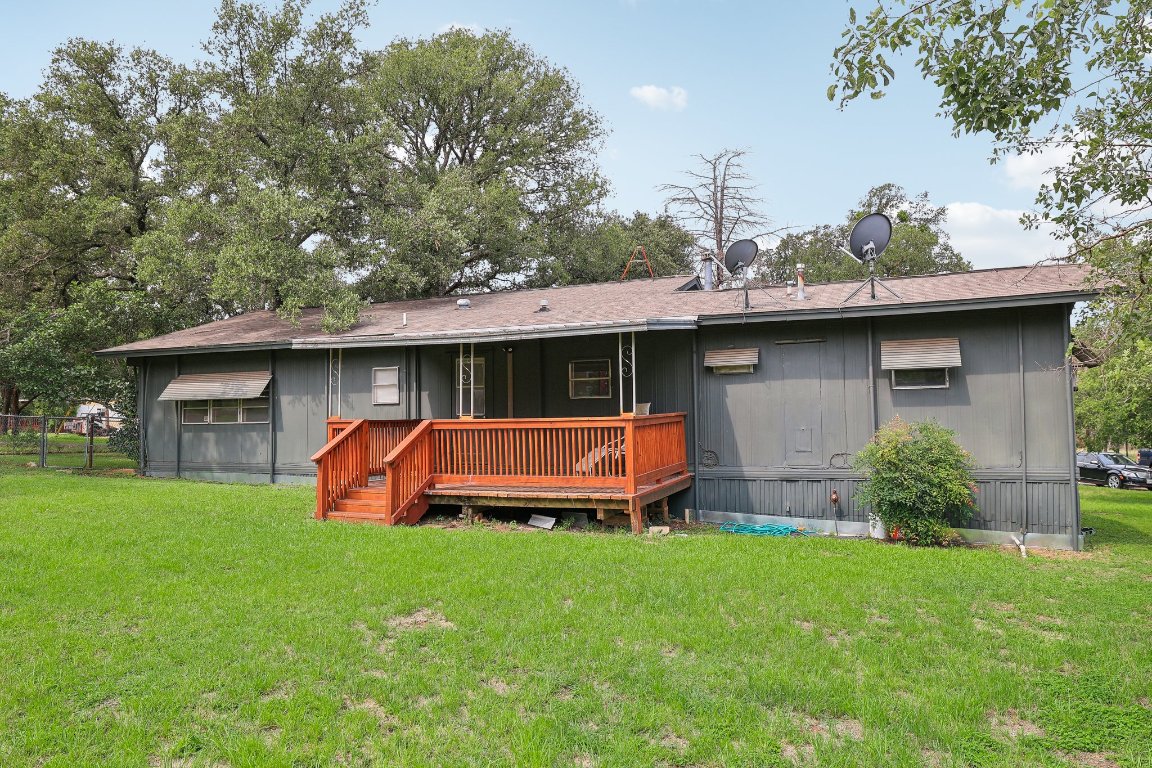 201 Bronco Drive Burnet, TX 78611 - Photo 24 of 30 a front view of a house with a yard table and chairs