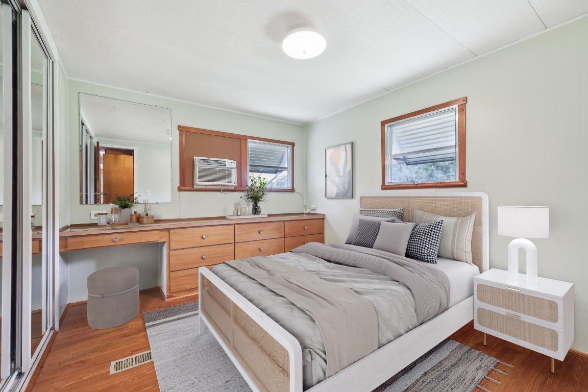 201 Bronco Drive Burnet, TX 78611 - Photo 9 of 30 a bedroom with bed and a large mirror